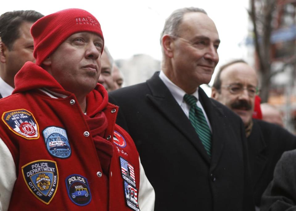 <div class="inline-image__caption"><p>John Feal stands in front of Sen. Charles Schumer (D-NY) while attending a news conference celebrating the passage of the James Zadroga 9/11 Health and Compensation Act near Ground Zero in New York on Dec. 23, 2010. </p></div> <div class="inline-image__credit">Lucas Jackson/Reuters</div>