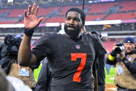 Cleveland Browns quarterback Jacoby Brissett walks off the field following the team's 23-17 overtime win over the Tampa Bay Buccaneers in an NFL football game in Cleveland, Sunday, Nov. 27, 2022. (AP Photo/David Richard)