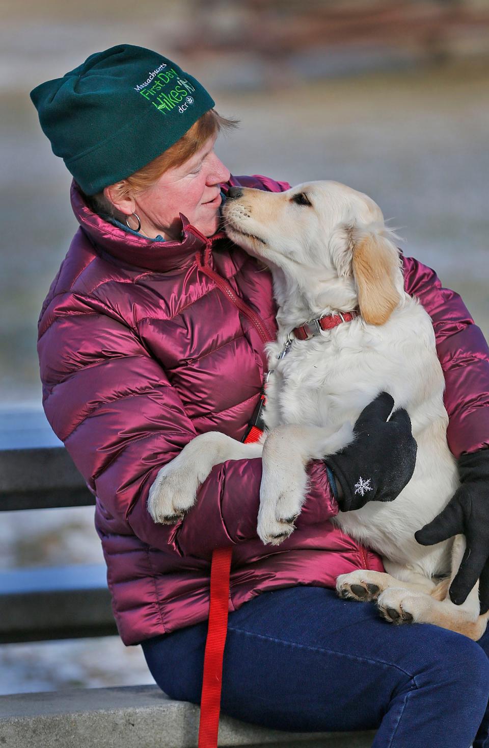 Maggi Brown, of Weymouth, with her new golden retriever puppy, K.D.