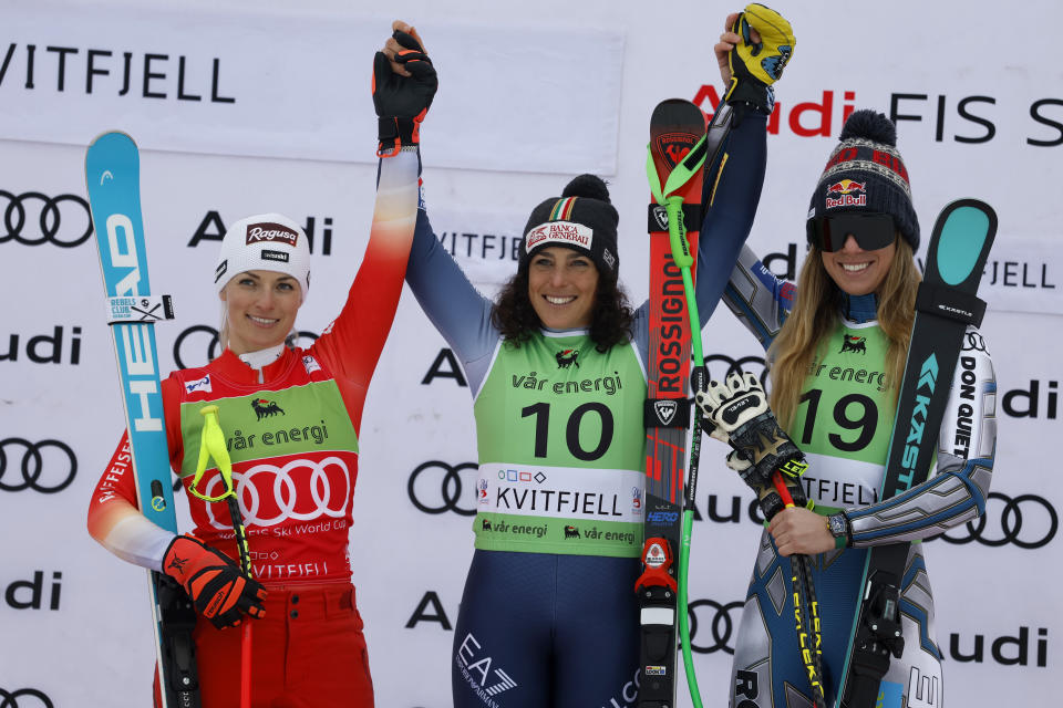 Italy's Federica Brignone, center, winner of an alpine ski, women's World Cup super-G race, celebrates on the podium with second-placed Switzerland's Lara Gut Behrami, left, and third-placed Czech Republic's Ester Ledecka, in Kvitfjell, Norway, Sunday, March 3, 2024. (AP Photo/Alessandro Trovati)