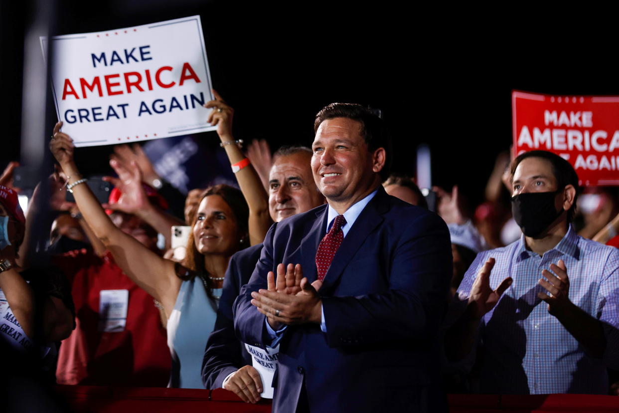 Florida Gov. Ron DeSantis attends a campaign rally by then-President Donald Trump in Opa-Locka, Fla., on Nov. 2, 2020. 