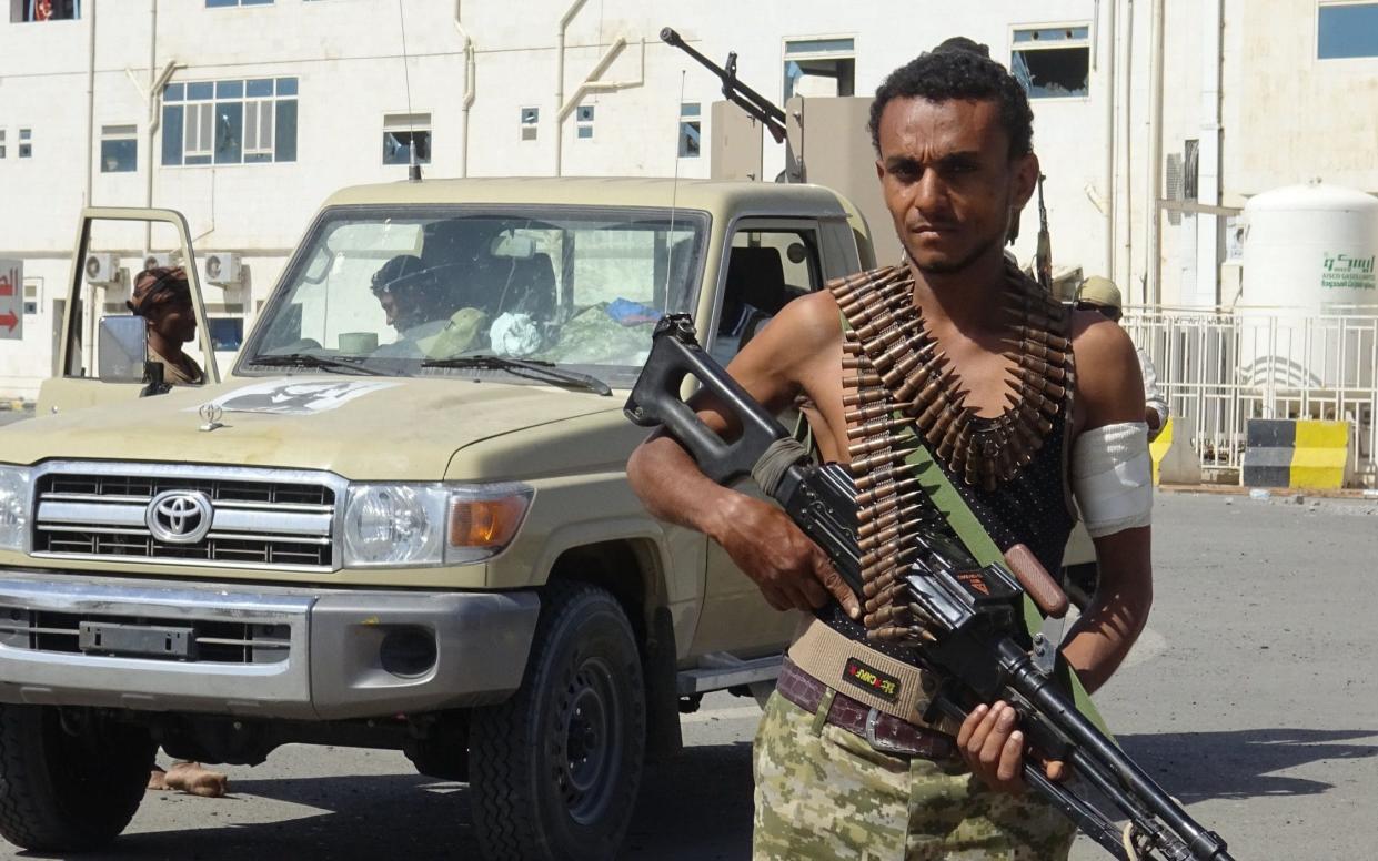 A member of the Yemeni pro-government forces is pictured in front of the May 22 Hospital on the eastern outskirts of Hodeidah, a key port city - AFP