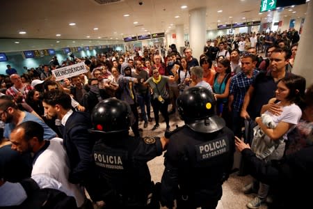 Protesters demonstrate at the airport, after a verdict in a trial over a banned independence referendum, in Barcelona