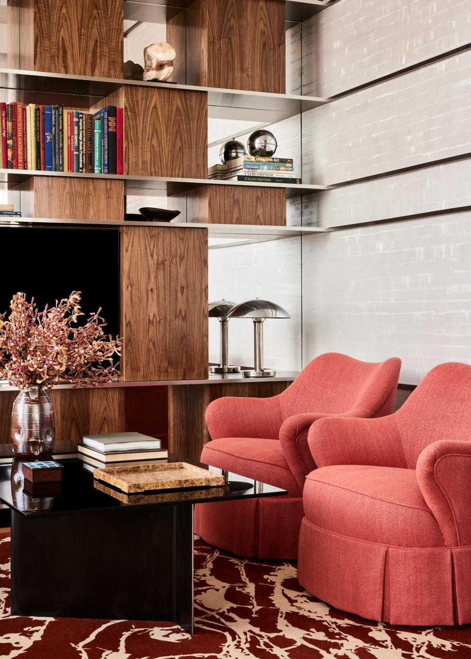 A bookshelf with a mirrored back