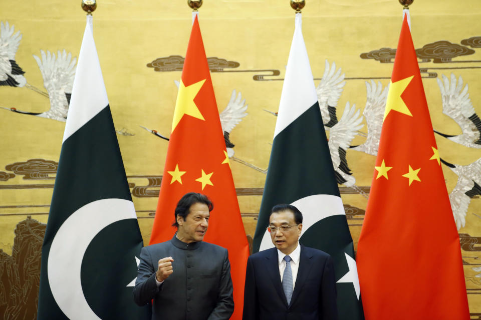 Pakistani Prime Minister Imran Khan, left, and China's Premier Li Keqiang attend a signing ceremony at the Great Hall of the People in Beijing Saturday, Nov. 3, 2018. (Jason Lee/Pool Photo via AP)