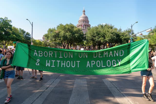 <p>SUZANNE CORDEIRO/AFP via Getty</p> A rally in Austin protesting the state's ban on abortion.