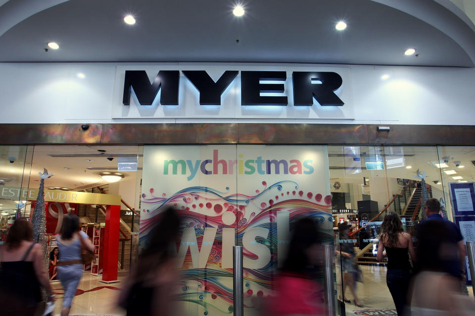 Blurred images of Christmas shoppers entering Myer department store in Pitt Street Mall during the Christmas shopping period on December 19, 2009 in Sydney, Australia. 