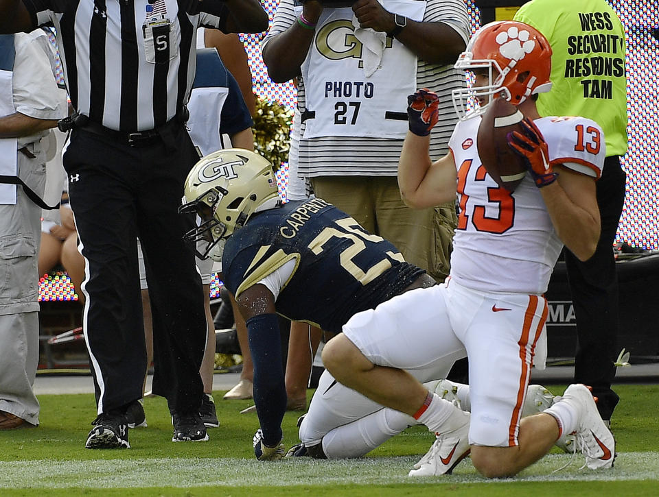 Clemson wide receiver Hunter Renfrow (13) celebrates his touchdown against Georgia Tech linebacker Tre' Jackson (25) during the first half of an NCAA college football game, Saturday, Sept. 22, 2018, in Atlanta. (AP Photo/Mike Stewart)