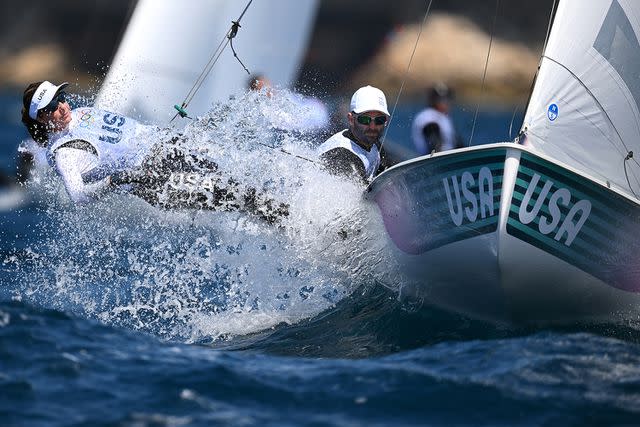 <p>Clive Mason/Getty</p> Lara Dallman-Weiss and Stu McNay of Team United States practice during a Mixed Dinghy sailing training session ahead of the Paris 2024 Olympic Games at Marseille Marina on July 24, 2024 in Marseille, France