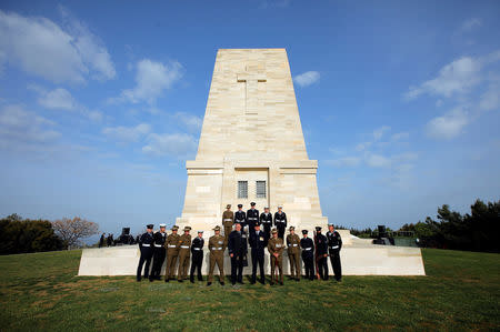 Australian soldiers pose at the Lone Pine Australian memorial before a ceremony to mark the 104th anniversary of the World War One battle of Gallipoli, in the Gallipoli peninsula in Canakkale, Turkey, April 25, 2019. REUTERS/Kemal Aslan