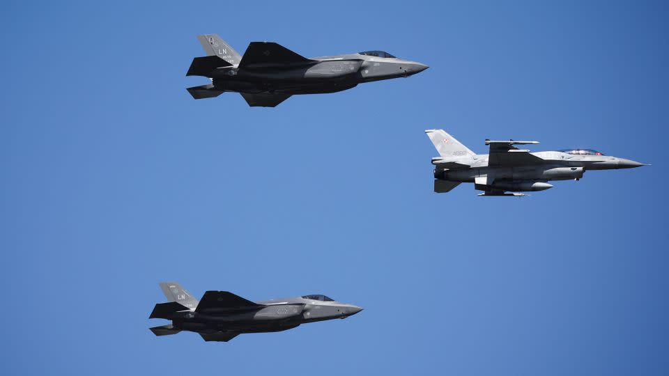 US Air Force F-35 jets and Polish Air Force F-16 jet participate in the military parade. - Kacper Pempel/Reuters