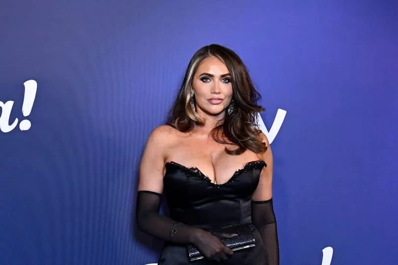 Amy Childs at the ITV Palooza event in 2023 wearing a black dress and matching gloves