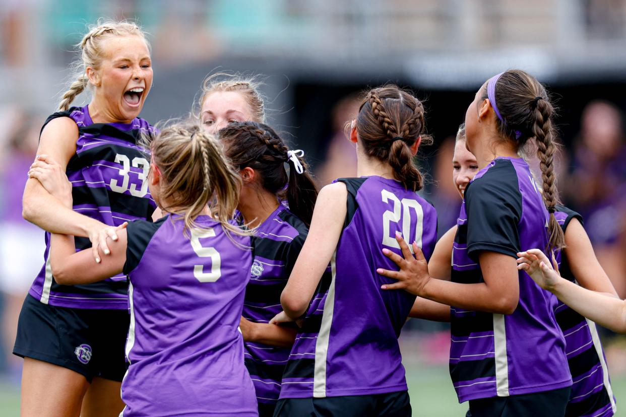 Community Christian’s Elle Canty (33) celebrates with her teammates after scoring a goal during the Class 3A girls state championship soccer game between Community Christian and Casady in Oklahoma City, on Saturday, May 11, 2024.