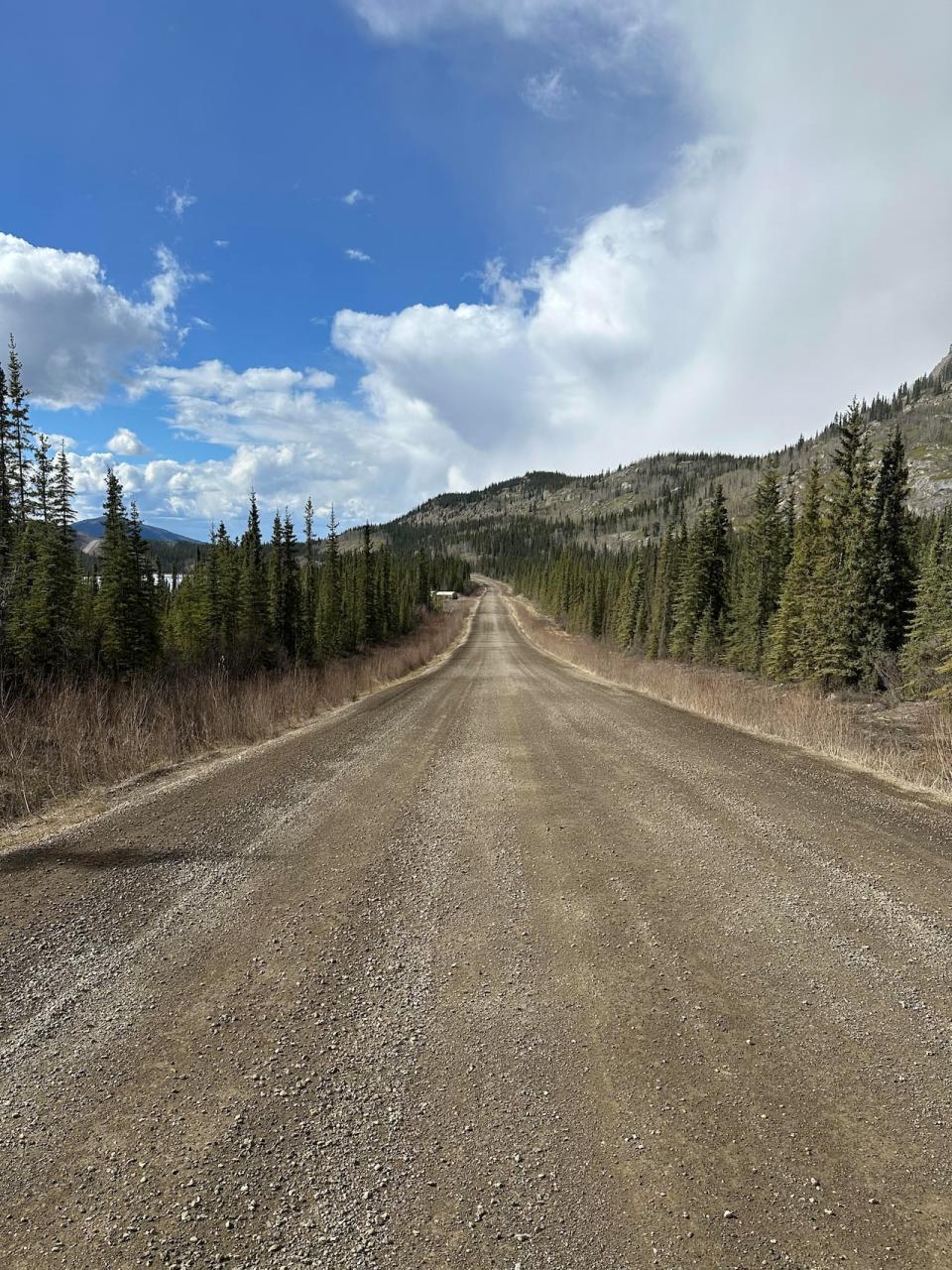 The road leading to Ross River, as seen pictured above, is a tough, rocky path filled with potholes, loose gravel and dirt, making it difficult to drive on. Ross River Dena Council Chief Dylan Loblaw says the community is not well served due to its isolation. 