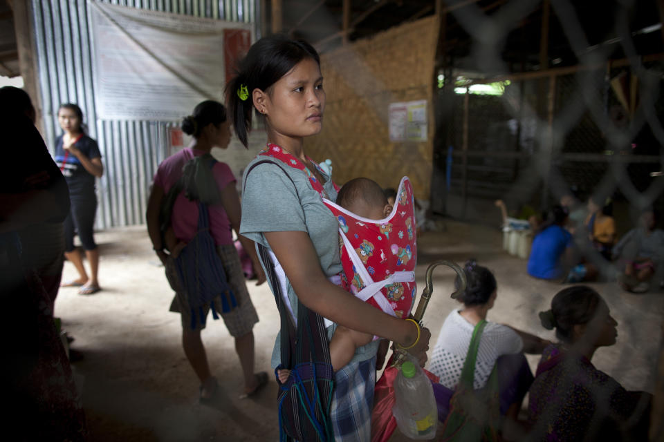 A Burmese woman waits for food rations to be given out at the Thai Burmese Border Center inside the Mae La refugee camp June 7, 2012 in Tak province, Thailand.&nbsp;