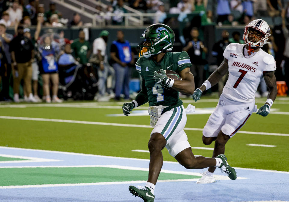 Tulane wide receiver Jha'Quan Jackson (4) catches a touchdown past South Alabama cornerback Marquise Robinson (7) during the second quarter of an NCAA college football game in New Orleans, Saturday, Sept. 2, 2023. (AP Photo/Derick Hingle)