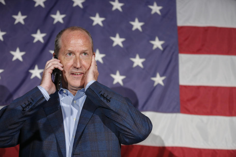 North Carolina 9th district Republican congressional candidate Dan Bishop waits to speak by phone with President Trump at his victory party in Monroe, N.C., Tuesday, Sept. 10, 2019. (AP Photo/Nell Redmond)