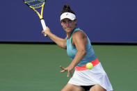 Jennifer Brady, of the United States, returns a shot to Caroline Garcia, of France, during the third round of the US Open tennis championships, Friday, Sept. 4, 2020, in New York. (AP Photo/Seth Wenig)