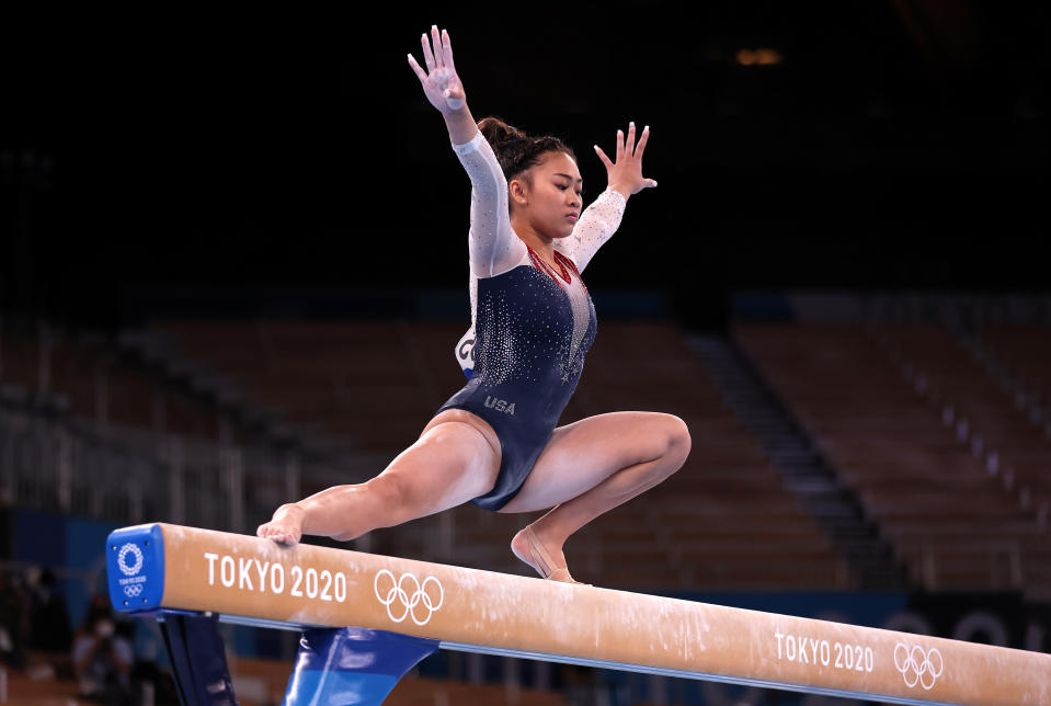 <p>TOKYO, JAPAN - JULY 29: Sunisa Lee of Team United States competes on balance beam during the Women's All-Around Final on day six of the Tokyo 2020 Olympic Games at Ariake Gymnastics Centre on July 29, 2021 in Tokyo, Japan. (Photo by Jamie Squire/Getty Images)</p> 