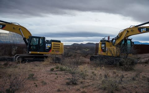 A section of the border fence in Naco, Arizona, being replaces with modern barriers  - Credit: &nbsp;UPI / Barcroft Media