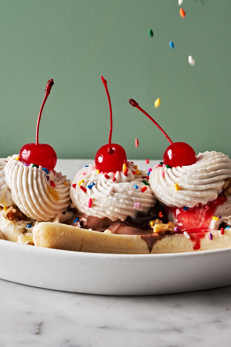 banana split with chocolate sauce and strawberry syrup