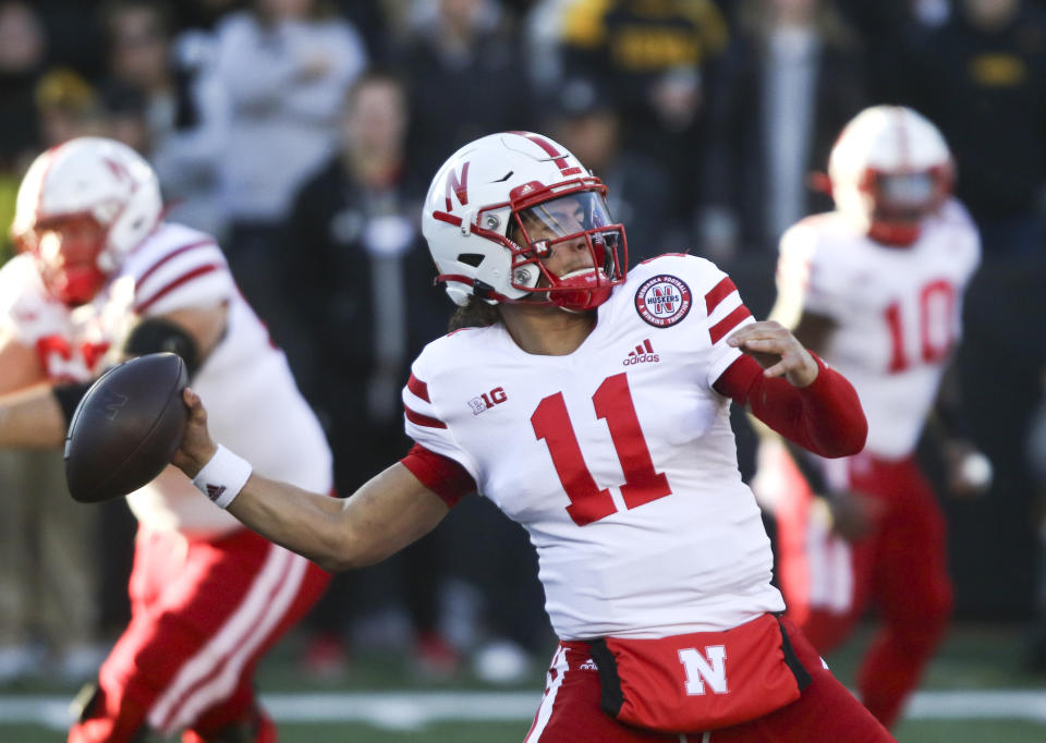 IOWA CITY, IOWA- NOVEMBER 25:  Quarterback Casey Thompson #11 of the Nebraska Cornhuskers throws a pass during the first half against the Iowa Hawkeyes at Kinnick Stadium, on November 25, 2022 in Iowa City, Iowa.  (Photo by Matthew Holst/Getty Images)