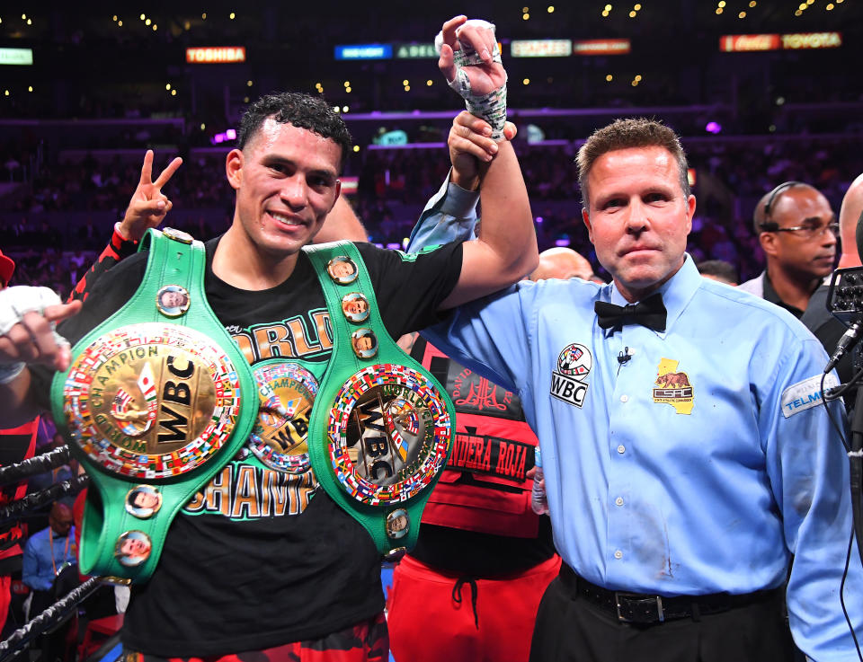 LOS ANGELES, CA - SEPTEMBER 28: Referee Thomas Taylor with David Benavidez in the ring after defeating Anthony Dirrell (not  pictured) after a corner stoppage in their WBC Super Middleweight Championship fight at Staples Center on September 28, 2019 in Los Angeles, California. (Photo by Jayne Kamin-Oncea/Getty Images)