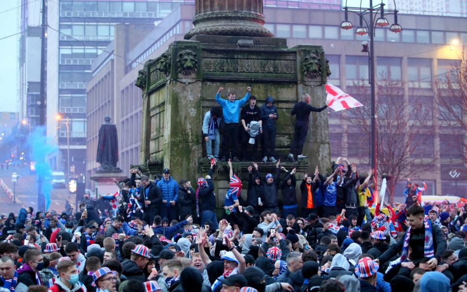 Rangers fans celebrate in George Square after Rangers win the Scottish Premiership title - PA