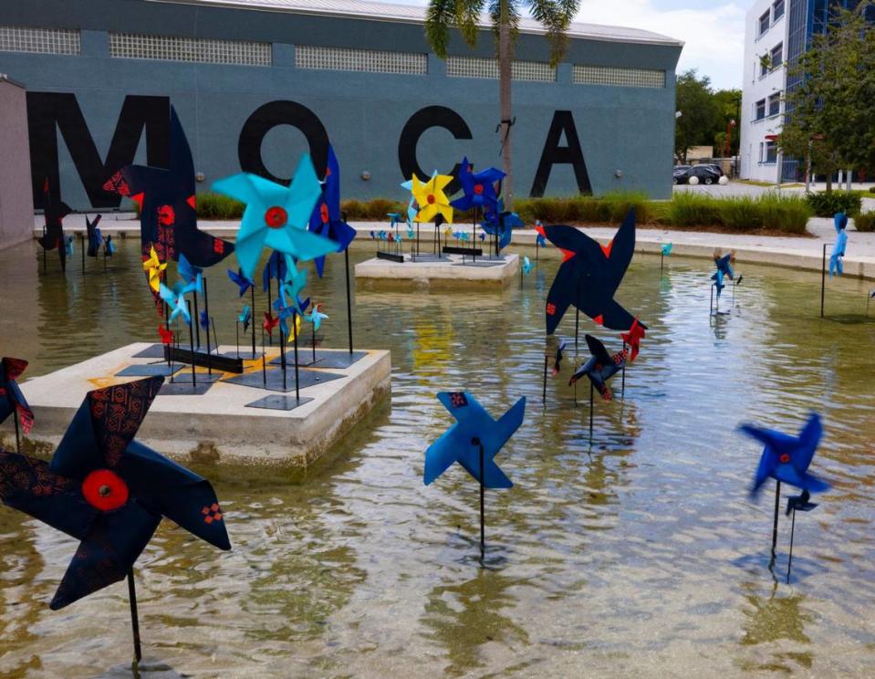 “For those who transcend in the wind”, a pinwheel exhibit by Miami-based artist Yanira Collado, on display in the courtyard of the Museum of Contemporary Art in North Miami. The artist uses the blue-green color that the Gullah people used to paint their porches to ward off spirits. The blue pinwheel also serves as a symbol for child abuse awareness.