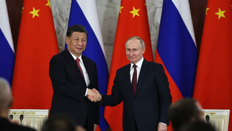 Russian President Vladimir Putin, right, and Chinese President Xi Jinping shake hands after speaking to the media during a signing ceremony following their talks at The Grand Kremlin Palace, in Moscow, Russia, March 21, 2023. China’s leader Xi just concluded his three-day visit with Russian President Putin.