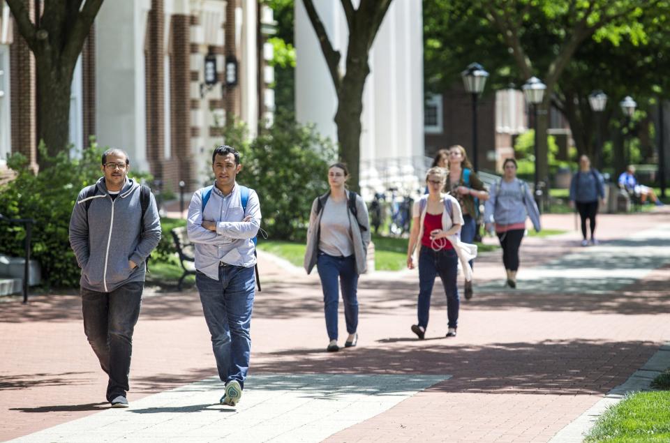 Students walk through the University of Delaware's campus in Newark on an afternoon in 2017.