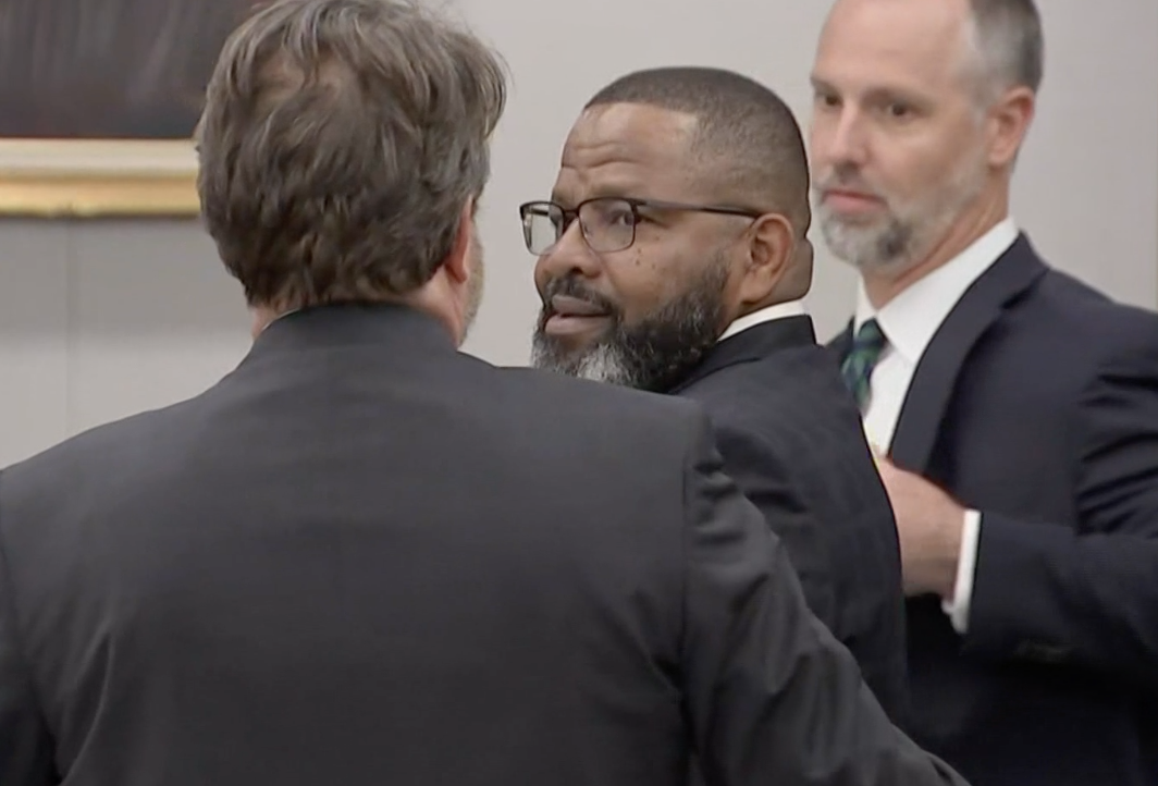 A relieved Darryl Daniels smiles and prepares to embrace his attorneys after the jury announced the former Clay County sheriff is not guilty on all counts in his trial.
