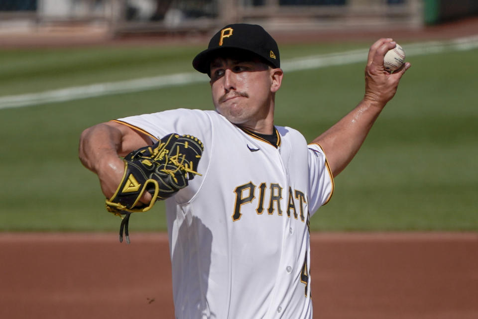 Pittsburgh Pirates starter Derek Holland pitches against the Milwaukee Brewers in the first inning of a baseball game, Saturday, Aug. 22, 2020, in Pittsburgh. (AP Photo/Keith Srakocic)