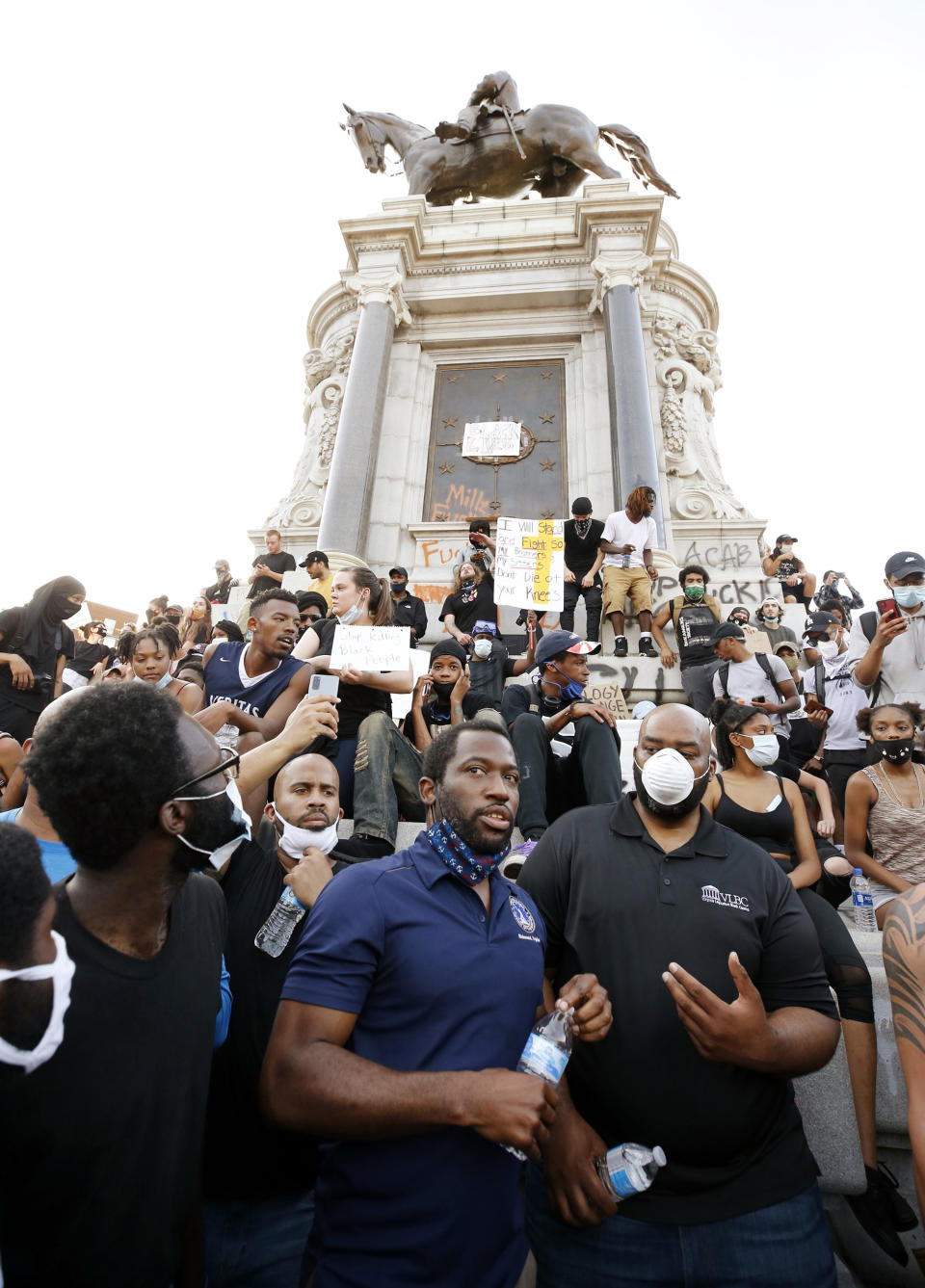 Mayor Stoney with demonstrators at the base of the Richmond monument to Robert E. Lee on June 2.