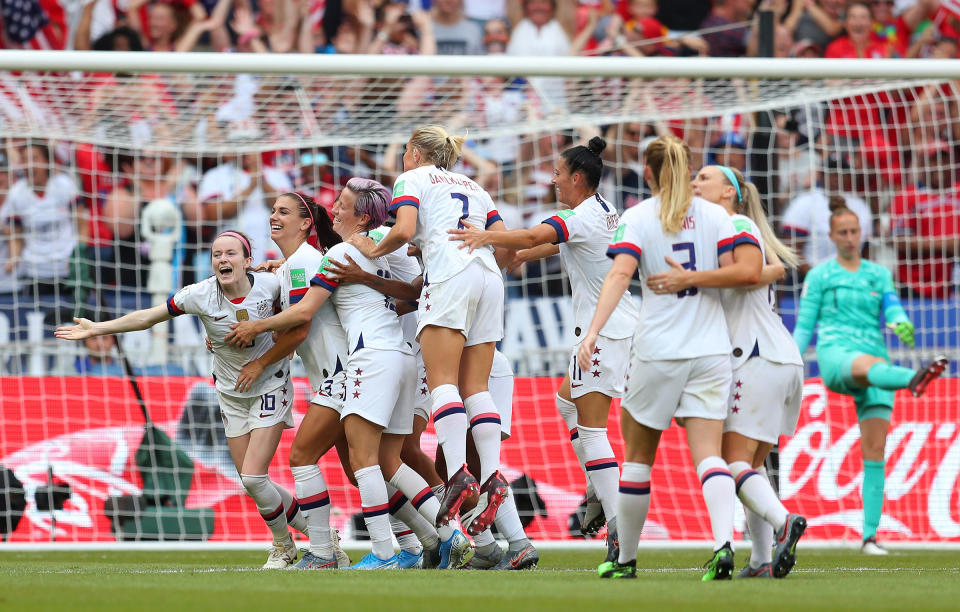 Rose Lavelle celebrates with teammates after scoring her team's second goal during the Women's World Cup Final in Lyon, France on July 07 | Catherine Ivill—FIFA/Getty Images