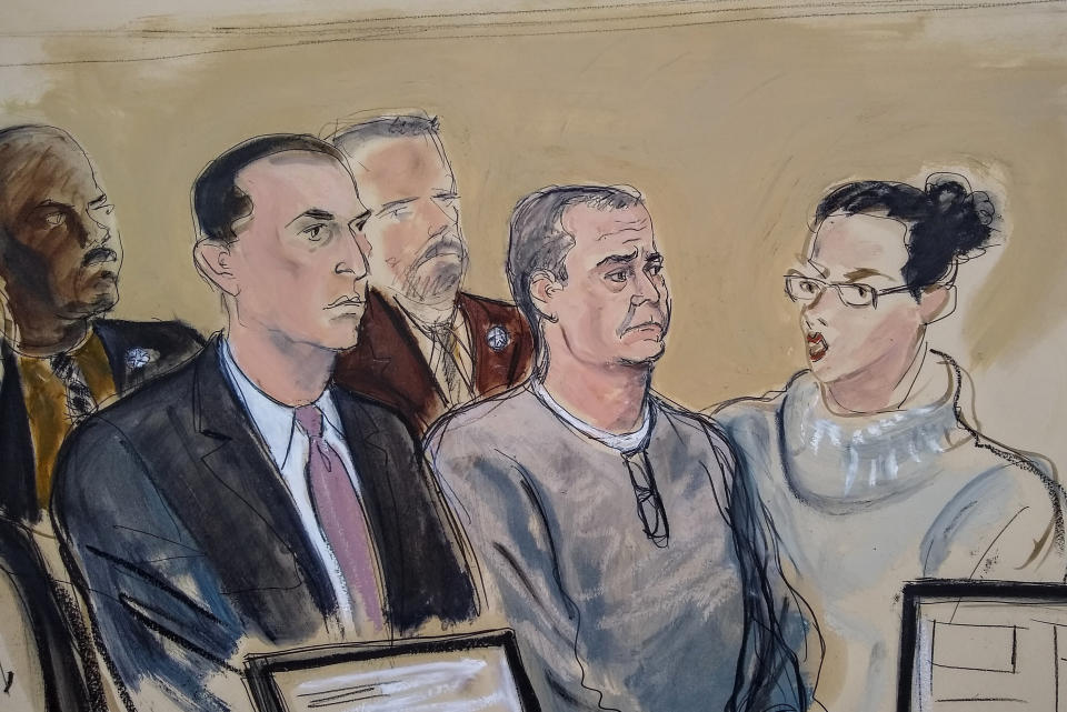 FILE- In this Jan 3, 2020 file courtroom sketch, defense attorney Cesar de Castro, left, Mexico's former top security official, Genaro Garcia Luna, center, and a court interpreter, appear for an arraignment hearing in Brooklyn federal court in New York, Jan. 3, 2020. The former top security official is scheduled to go on trial Tuesday, Jan. 17, 2023, on charges he accepted millions of dollars in bribes in exchange for helping the powerful Sinaloa Cartel move drugs and its members avoid capture. (AP Photo/Elizabeth Williams, File)