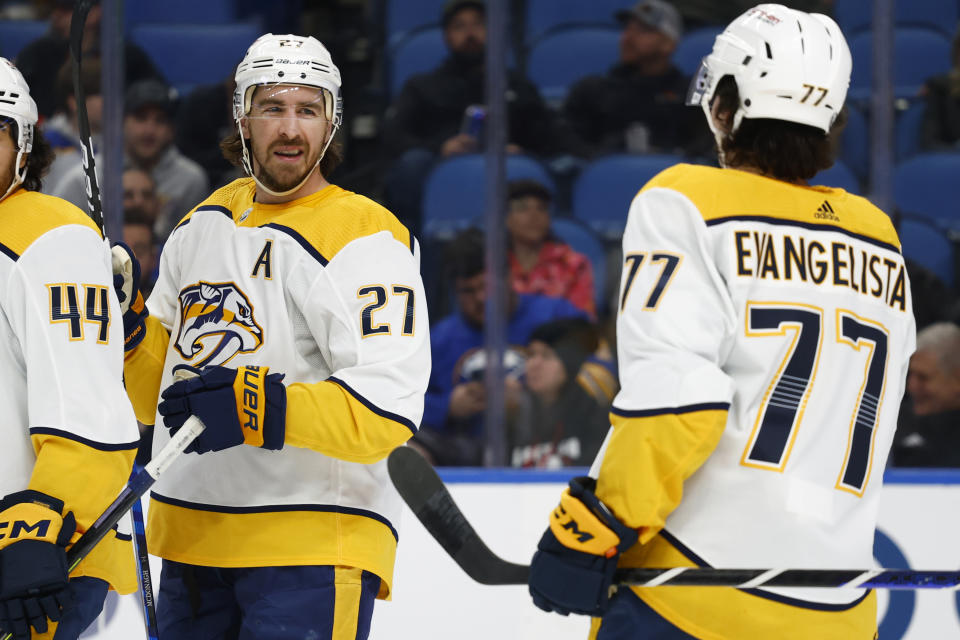 Nashville Predators defenseman Ryan McDonagh (27) celebrates his goal with right wing Luke Evangelista (77) during the second period of an NHL hockey game against the Buffalo Sabres, Tuesday, March 21, 2023, in Buffalo, N.Y. (AP Photo/Jeffrey T. Barnes)