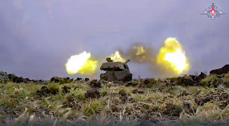In this photo taken from video and released by the Russian Defense Ministry Press Service on Monday, Jan. 23, 2023, a Russian Army self-propelled howitzer Akatsiya fires toward Ukrainian troops at an undisclosed location. (Russian Defense Ministry Press Service via AP)
