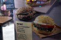 FILE PHOTO: A poster showing product from plant-based burger maker Impossible foods been using at Starbucks, in Hong Kong