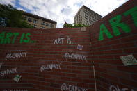 <p>A temporary wall on display for the LEAP Public Art Program’s citywide exhibition show in Union Square Park in New York City on June 5, 2018. (Photo: Gordon Donovan/Yahoo News) </p>