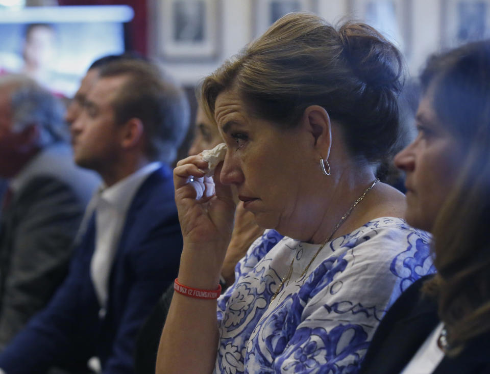 Gail Box, the mother of former University of Oklahoma football player Austin Box, who died of a drug overdose in 2011, listens during closing arguments in Oklahoma's ongoing opioid drug lawsuit against Johnson & Johnson Monday, July 15, 2019, in Norman, Okla. (AP Photo/Sue Ogrocki)