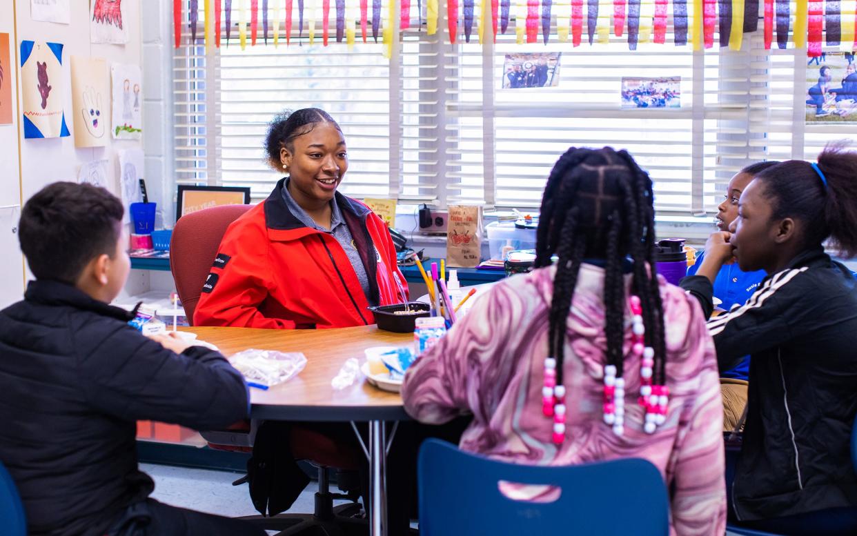 Student Success Coach Ni'yanna Anderson provides mentorship and academic support to a small group of students. Anderson is currently serving her second year as a coach with City Year Jacksonville.