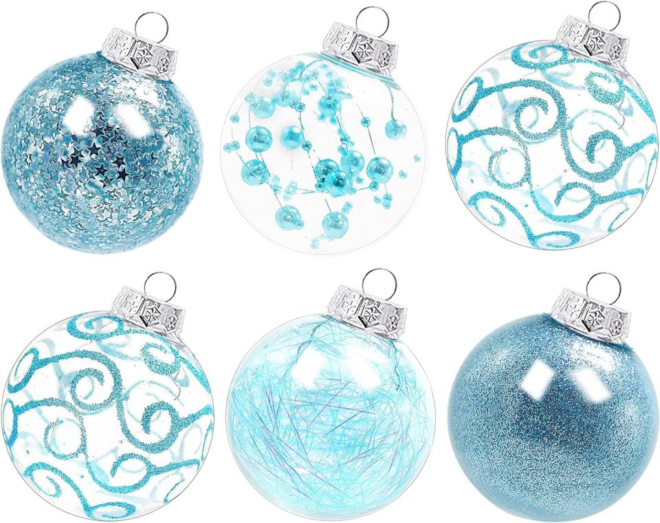 set of six light blue and clear patterned ornaments