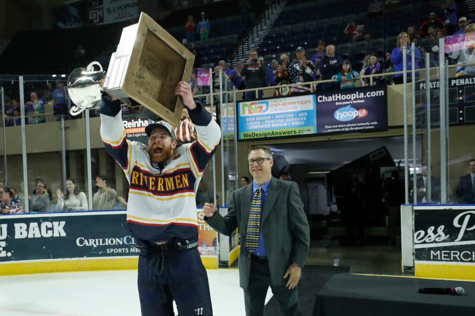 Peoria Rivermen captain and Peoria native Alec Hagaman takes the President's Cup from SPHL commissioner Doug Price after clinching the championship at Berglund Center on May 3, 2022.