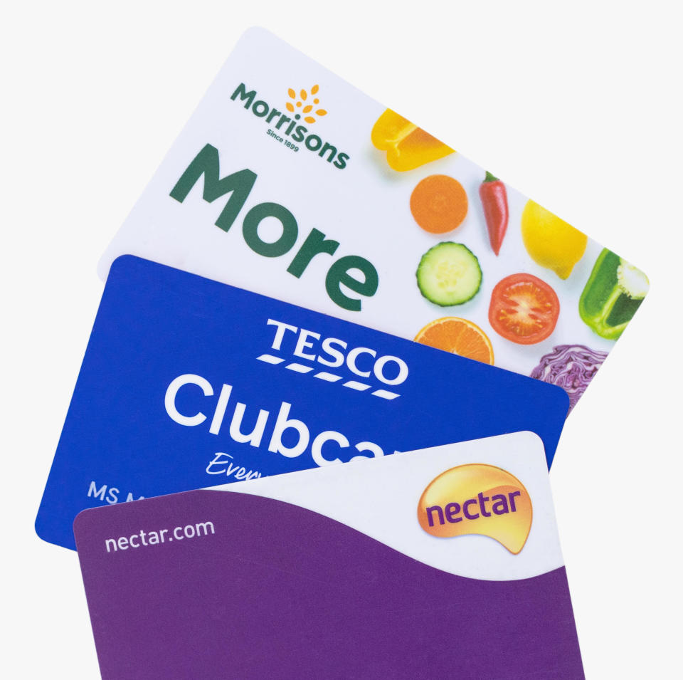 - Sainsburys Nectar card, Tesco clubcard and Morrisons More cards isolated on a white background