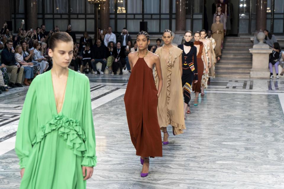 Models present creations from designer Victoria Beckham during a catwalk show for the Spring/Summer 2020 collection on the third day of London Fashion Week in London on September 15, 2019. (Photo by Niklas HALLE'N / AFP)        (Photo credit should read NIKLAS HALLE'N/AFP/Getty Images)