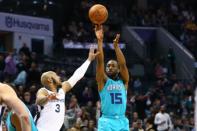 Feb 1, 2019; Charlotte, NC, USA; Charlotte Hornets guard Kemba Walker (15) shoots the ball over Memphis Grizzlies guard Jevon Carter (3) in the second half at Spectrum Center. Mandatory Credit: Jeremy Brevard-USA TODAY Sports