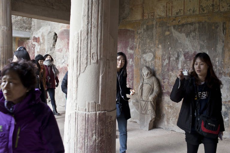 Tourists visit the restored Thermae Stabianae baths in Pompeii, Italy last March. A volcanic eruption devastated Pompeii nearly 2,000 years ago in 79 AD but the ash and rock helped preserve buildings almost in their original state