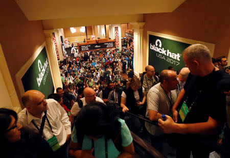 Attendees head to meeting rooms at the Black Hat information security conference in Las Vegas, Nevada, U.S. July 26, 2017. REUTERS/Steve Marcus