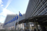 European Union flags flap in the wind outside EU headquarters in Brussels, Monday, March 25, 2024. The European Commission on Monday opened non-compliance investigations against Alphabet, Apple and Meta under the Digital Markets Act. (AP Photo/Virginia Mayo)